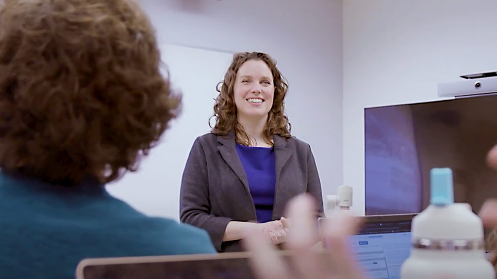Digital Humanities professor standing in front of a classroom
