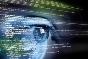 Image of Computer Code and reflection of human eye