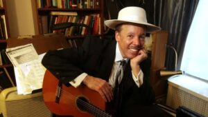 Brooks posed with guitar