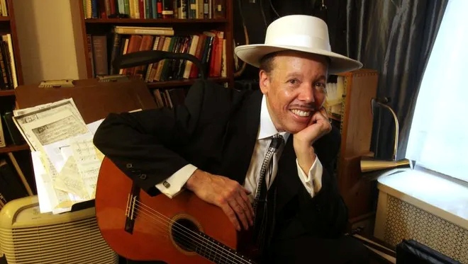 Brooks posed with guitar