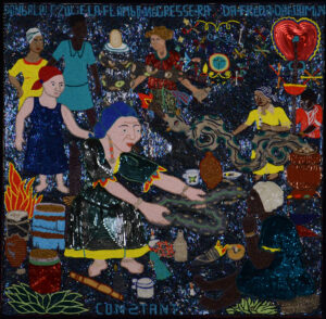 A square flag or tapestry comprised of many beads and sequins. The background is all blue and silver. In the foreground, a woman (presumably Vodou Loa Erzulie) holds out a snake to another woman seated on the ground. To the left are drums and a fire.In the background are five other figures, all standing. The rightmost of these also holds a long snake.