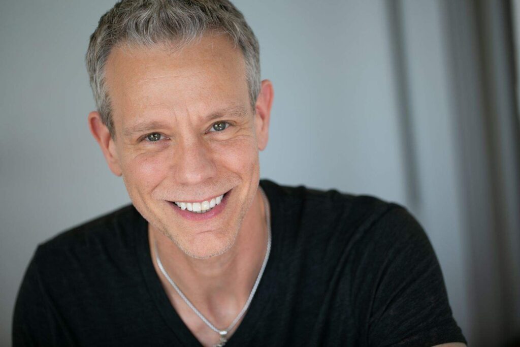 Headshot of Adam Pascal