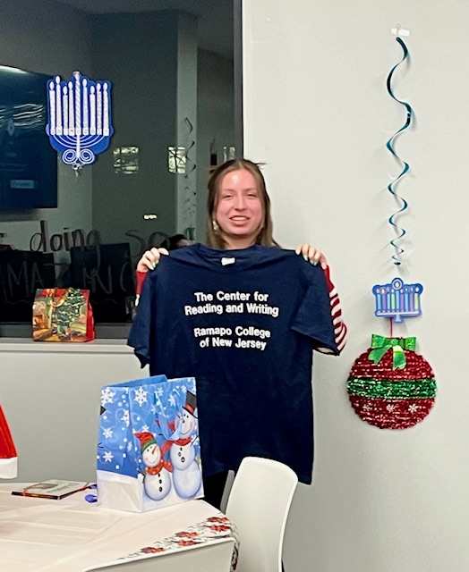 Amy and her CRW t-shirt, Ugly Sweater Holiday Party, 2023