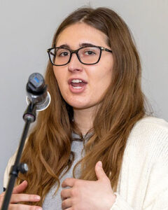 Ramapo student Michelle Kukan with long brown hair and glasses.