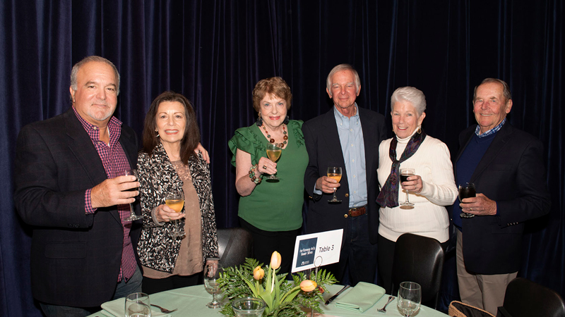 Group of donors holding wine glasses before Ramapo College's Performing Arts Dinner