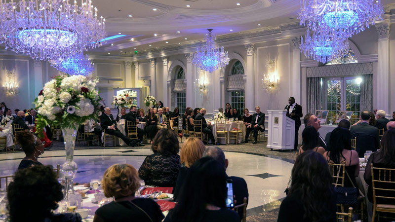 Ramapo's Distinguished Citizens Gala ballroom with guests sitting at tables