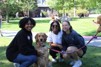 Three Students with Therapy Animal Penny