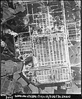 Black and white picture of Auschwitz from the air. It is large.