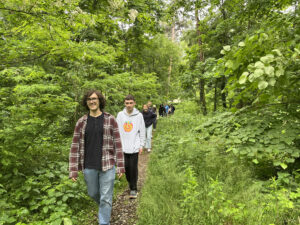 Students walking through the woods.