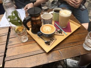 Coffee and tea drinks on a tray.