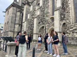 Students in front of a stone church
