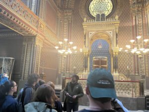 Students and a guide in Prague's Spanish synagogue. It is a very ornate, "orientalist"-style building.