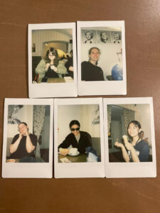 Polaroid-style pictures of individual students in an apartment.