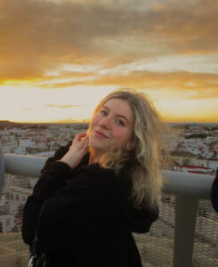 Headshot of Jordan in front of a sunset