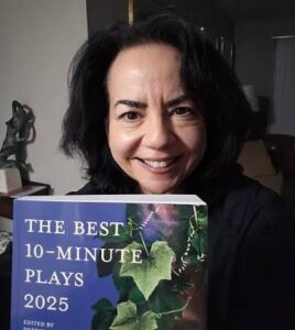 Headshot of Lori Myers holding a book