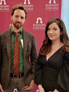 Davide Gurney and Cairenn Binder pose for photo in front of RCNJ backdrop