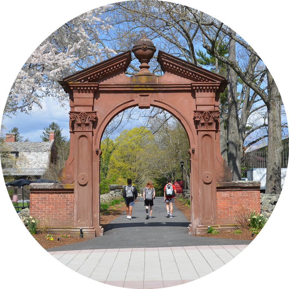 Three students walking outside under RCNJ's Archway