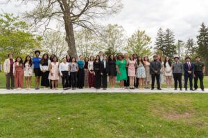 This photo is a collection of 2026 Student Leadership Award winners at the Pavilion Rock with President Jebb. 