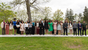 This photo is a collection of all 2026 Student Leadership Award winners with President Jebb at the Pavilion Rock.