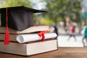 Liberal Arts graphic- Books, diploma and mortar board stacked up