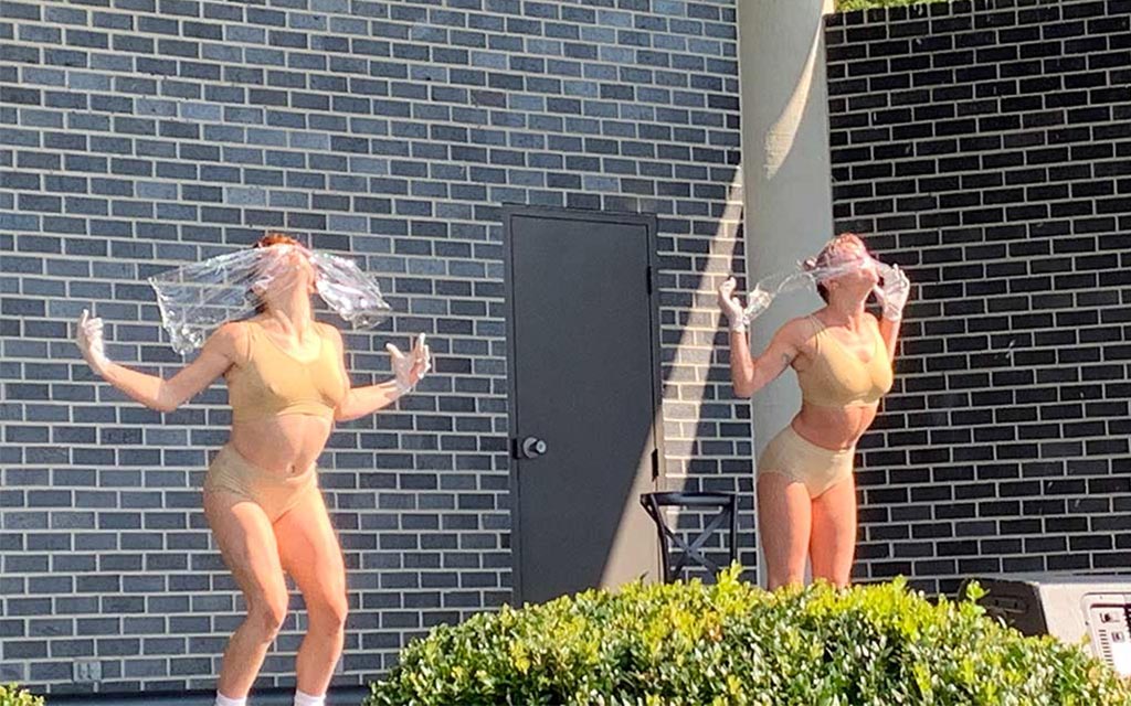 Two dancers performing at the bandshell performance