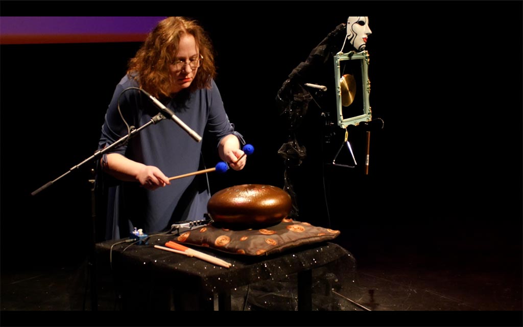 Percussionist playing drum on stage