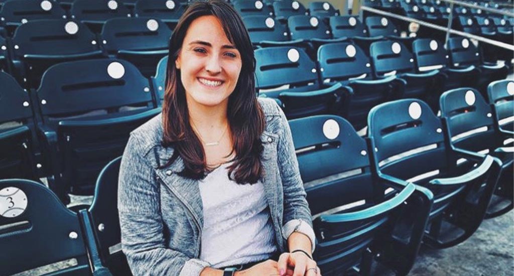 Alex Rigoli sitting in baseball stadium chairs