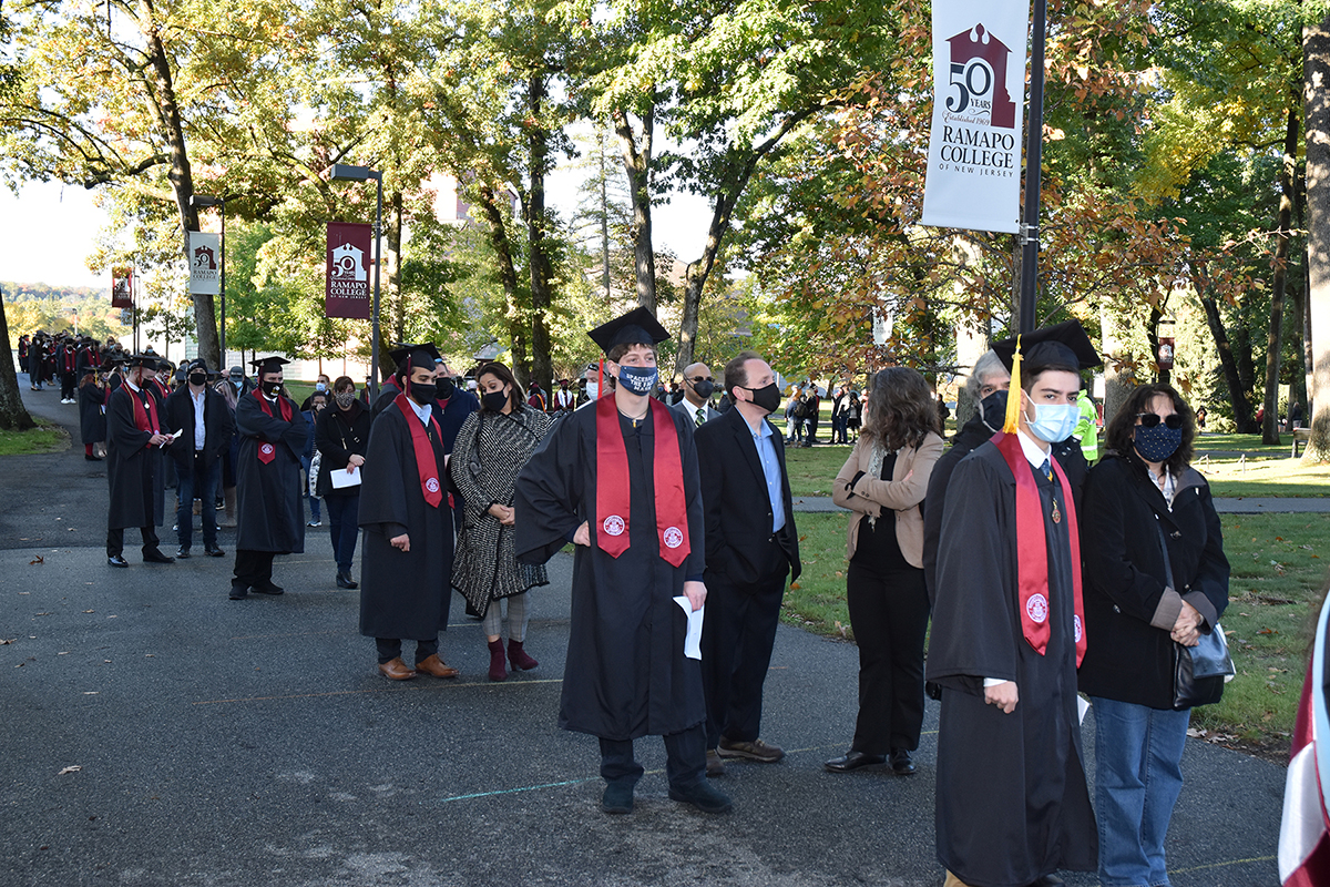 Class of 2020 Commencement-009-web Line of students and families preparing for commencement procession