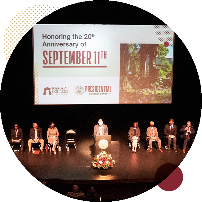 Panel on stage in observance for 9/11