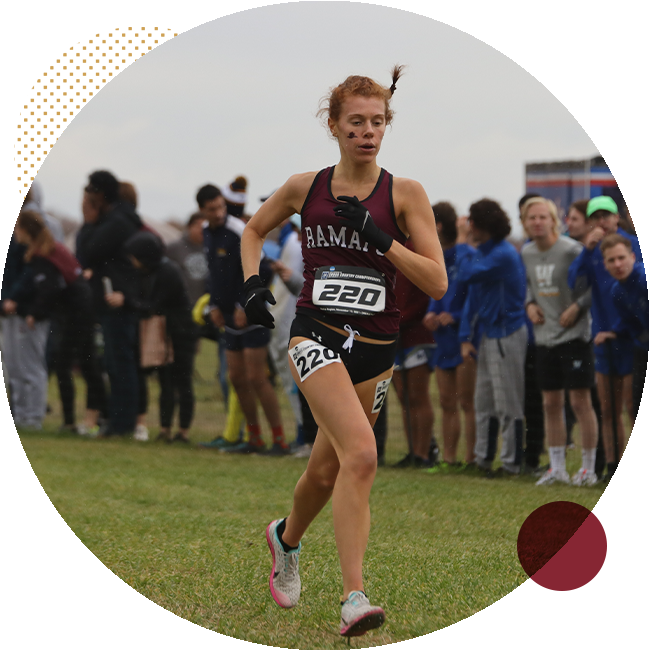 student running at cross country meet