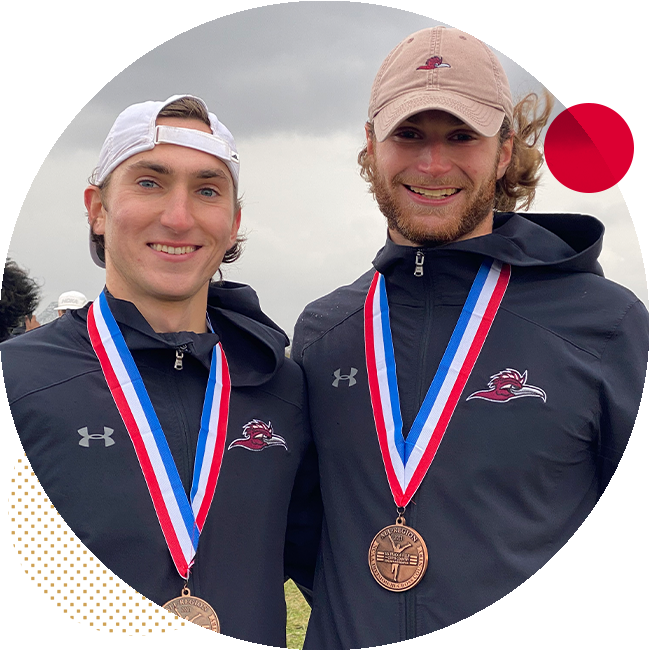 two students pose with their medals