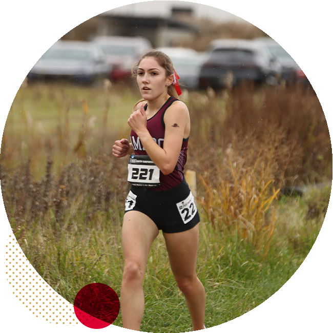 student running at cross country meet