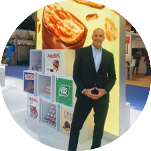 Jim Klein stands in front of a candy display