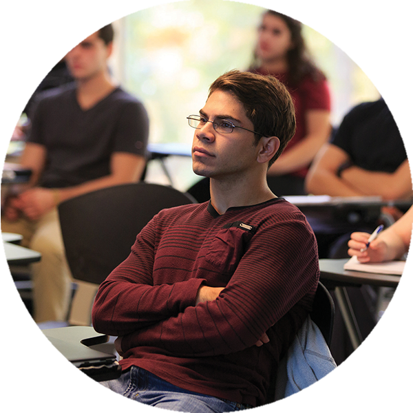 student paying attention to lesson in classroom