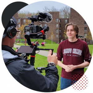 Male student filming a scene for the College Tour episode