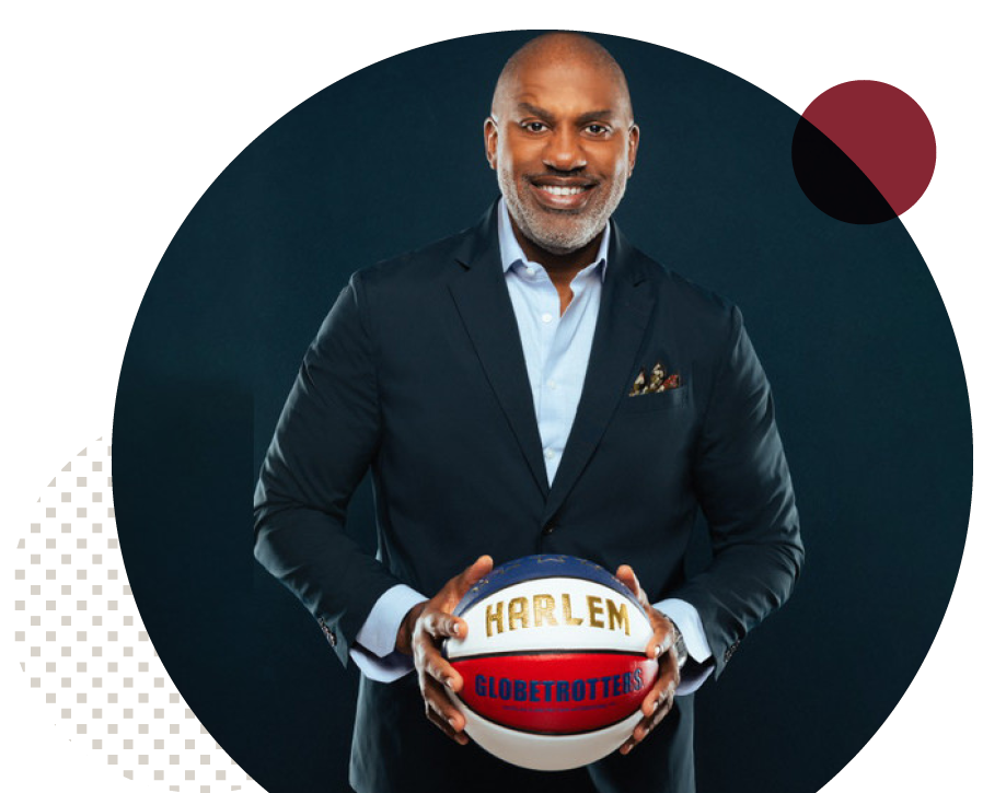 Keith Hawkins holding a Harlem Globetrottrers basketball
