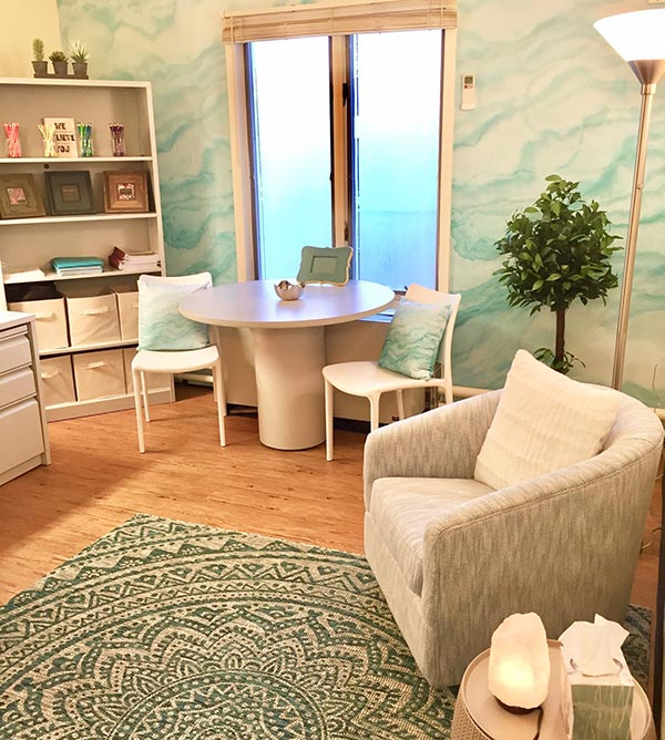 Healing Space room at Ramapo College with a comfy chair and table
