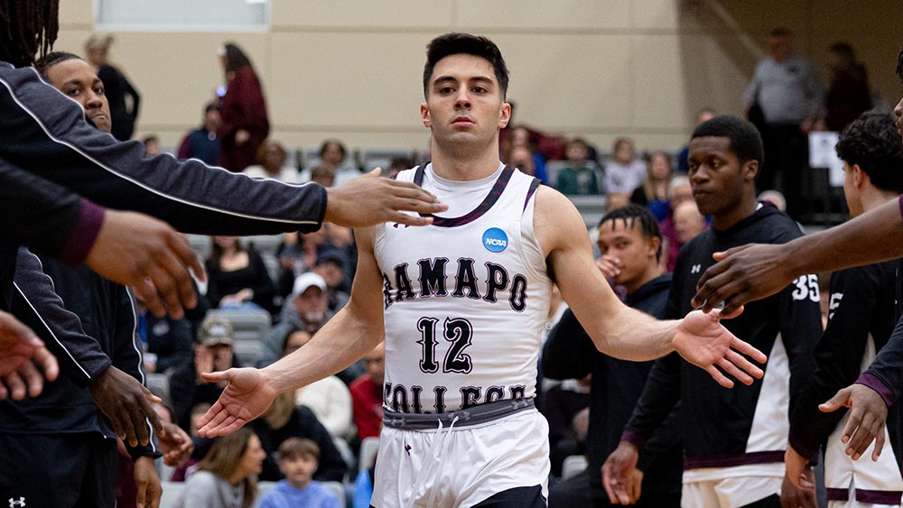 All-Business,-All-Heart--Peter-Gorman_fall2025-home Ramapo College basketball athlete, Peter Gorman, high-fiving opposing team