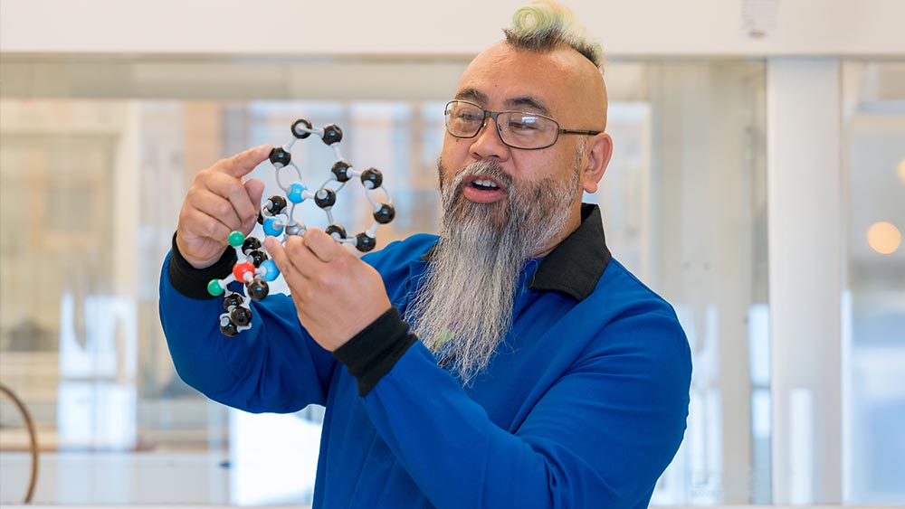 Breaking-the-Mold--TAS-Dean_fall2025-home Ramapo College's new science dean, Dr. Benny Chan, shares a molecular model