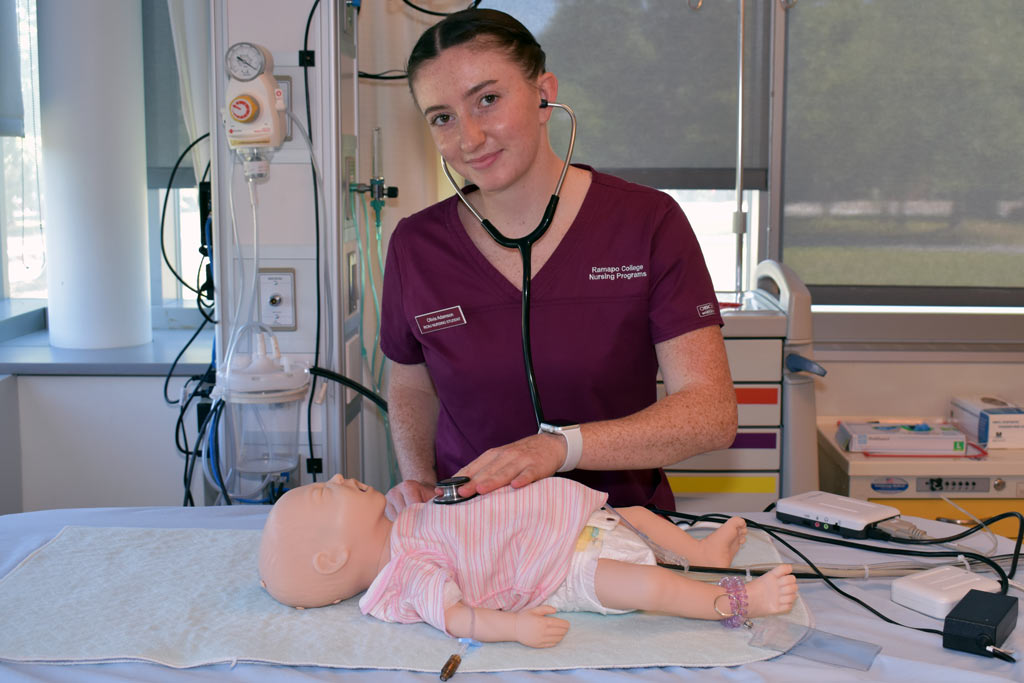 Olivia-Adamson-ROTC-Nursing-8.2548-(1) Olibia Adamson wearing Ramapo College nursing scrubs