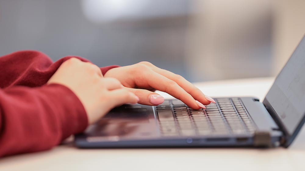 class-notes_fall2025-home Close-up of a hands typing on a laptop