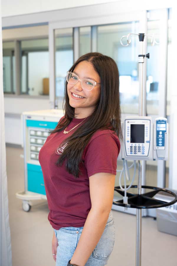 Vanessa Garcia smiling inside Ramapo’s state-of- the-art simulation lab.