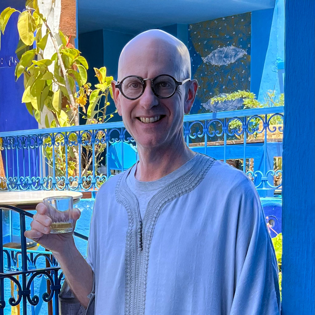 Ramapo College Literature Professor Benjamin Eric Daffron in a traditional kandura, drinking mint tea, in Café Clock in Chefchaouen in May 2024.