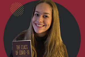 Young lady holding Class of 2019 book