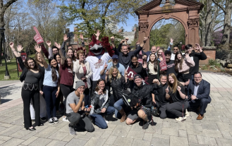 Group photo of Ramapo College students and staff in front of the Arch