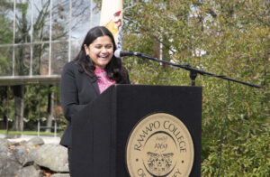 Uma Mahalingham speaking at the podium at the First-gen Student proclamation in November 2022.