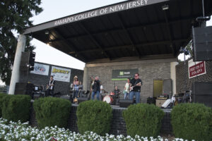 A band plays music on the bandshell at Ramapo College
