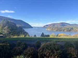 A beautiful landscape of a river flanked by mountains.