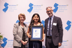 An awardee stands between RCNJ President Cindy Jebb and RBF Vice President Scott Berrie.