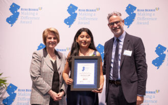 An awardee stands between RCNJ President Cindy Jebb and RBF Vice President Scott Berrie.